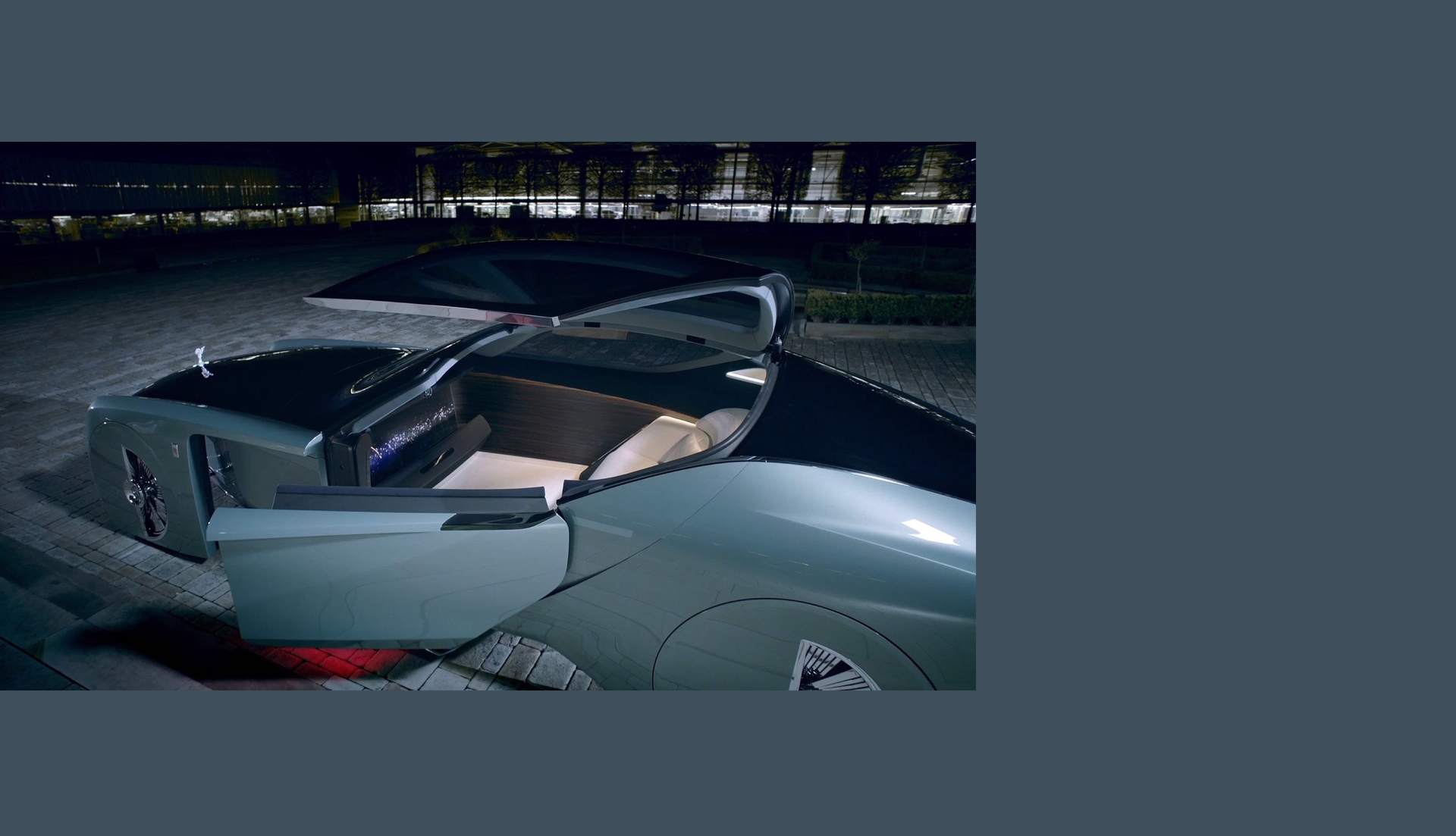 An angled view of the Rolls-Royce 103ex, with all of its futuristic doors opened.