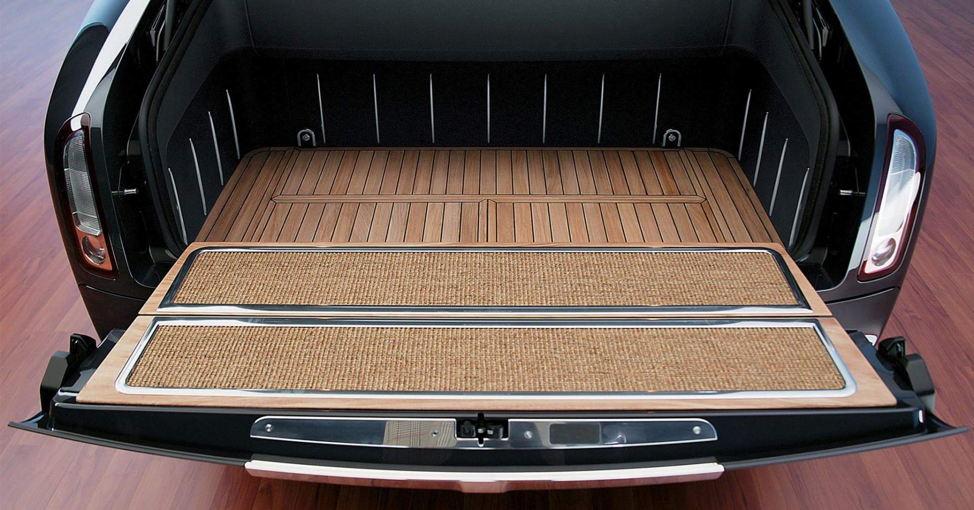 A close-up of the open boot of a prototype electric Rolls-Royce motor car.