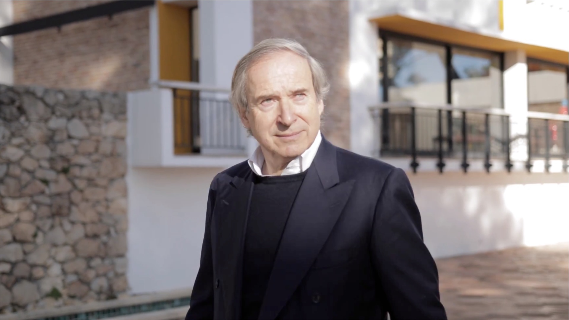 A photo of Simon De Pury wearing a black suit