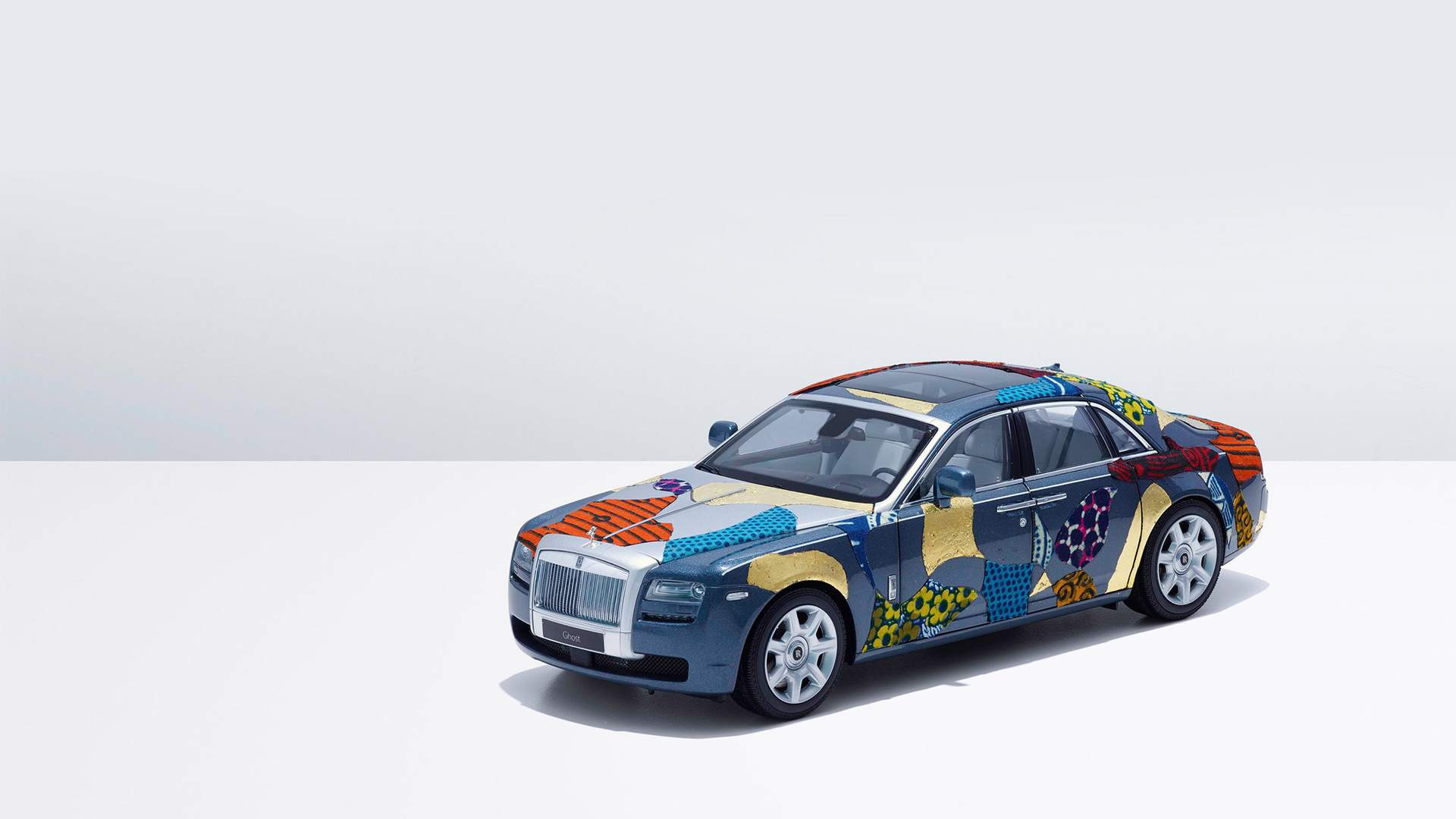 A miniature Rolls-Royce Ghost with a patchwork patter paint job. A piece made in collaboration between Rolls-Royce, Breast Cancer Care UK and some of the biggest names in contemporary art