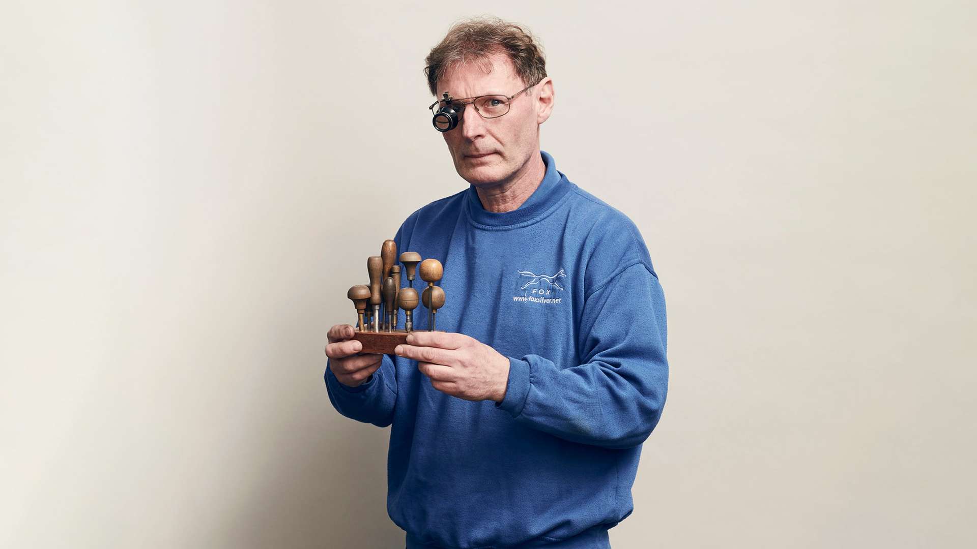 Rolls-Royce Bespoke Designer Alex Innes shown holding some of the tools used to create the Bespoke Fox Silver Phantom Gallery