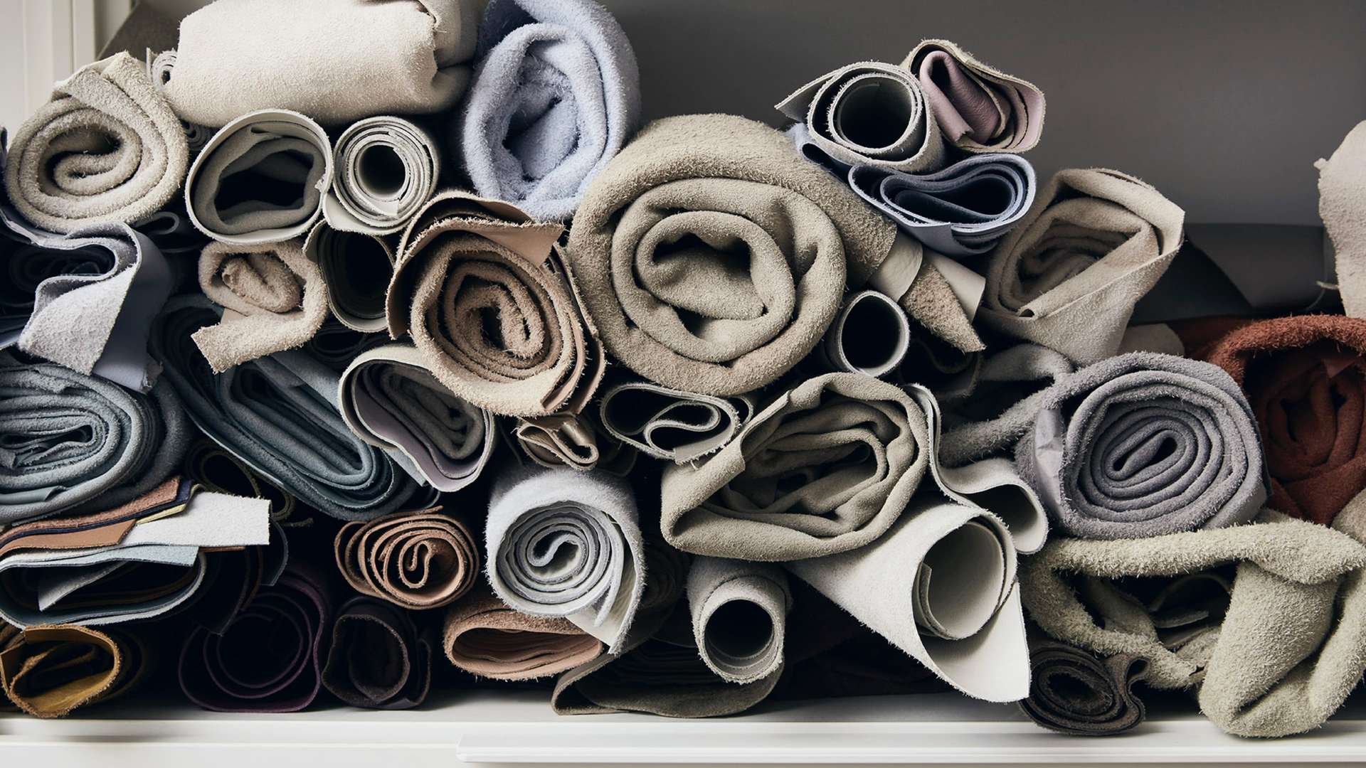 A close up showing some of the materials Helen Ann Murrey worked with to create a Bespoke Phantom Gallery for a Rolls-Royce Motor Car