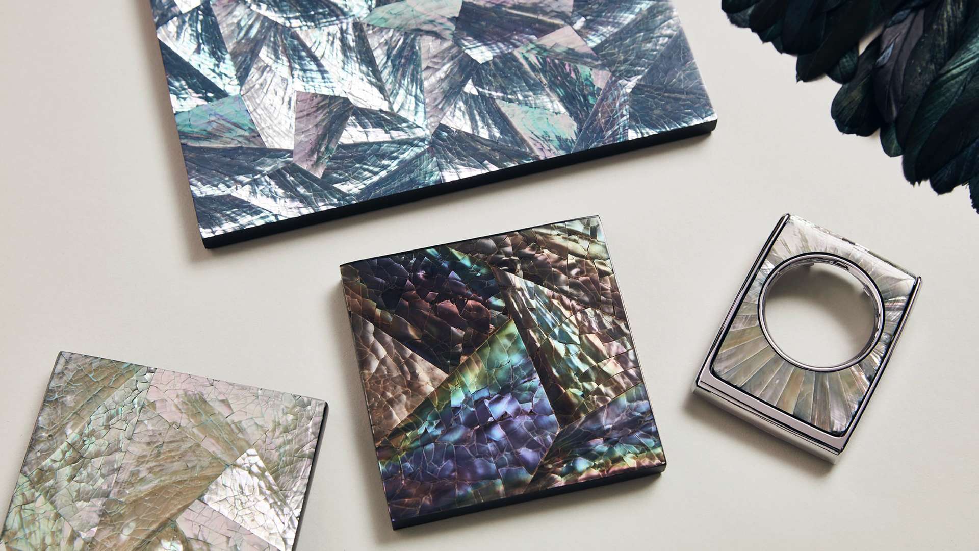  Swiss materials specialists Nature Squared created a Bespoke Phantom Gallery featuring over 3,000 tail feathers set against an iridescent material.