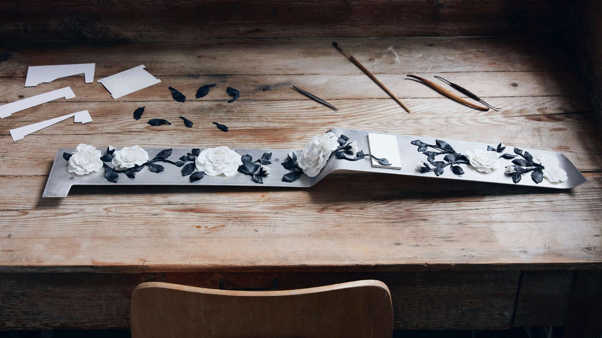 A Phantom Gallery created by world renowned porcelain makers Nymphenburg. The image shows the Gallery being created in a workshop, laid on a wooden table.