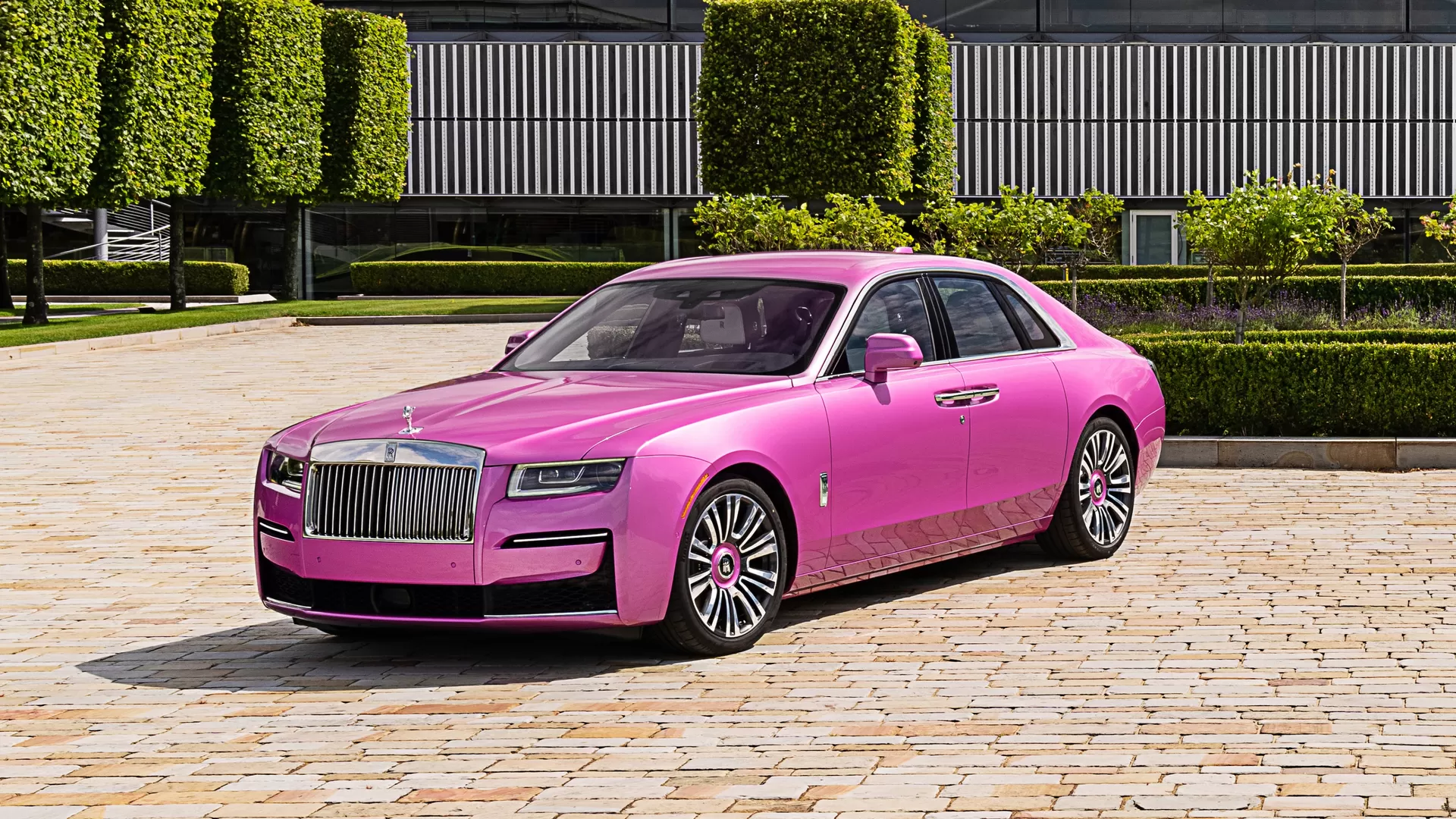 Side profile of Rolls Royce Ghost in a Friskee Pink colour