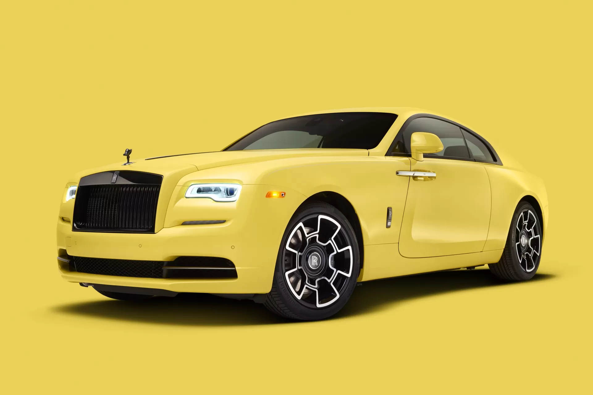 A side view of a Bespoke Pastel Wraith Rolls-Royce Motor Car