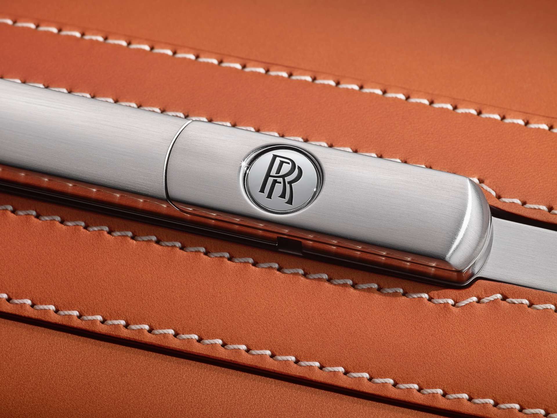 Close up of Rolls-Royce motif on a Phantom luggage bag.