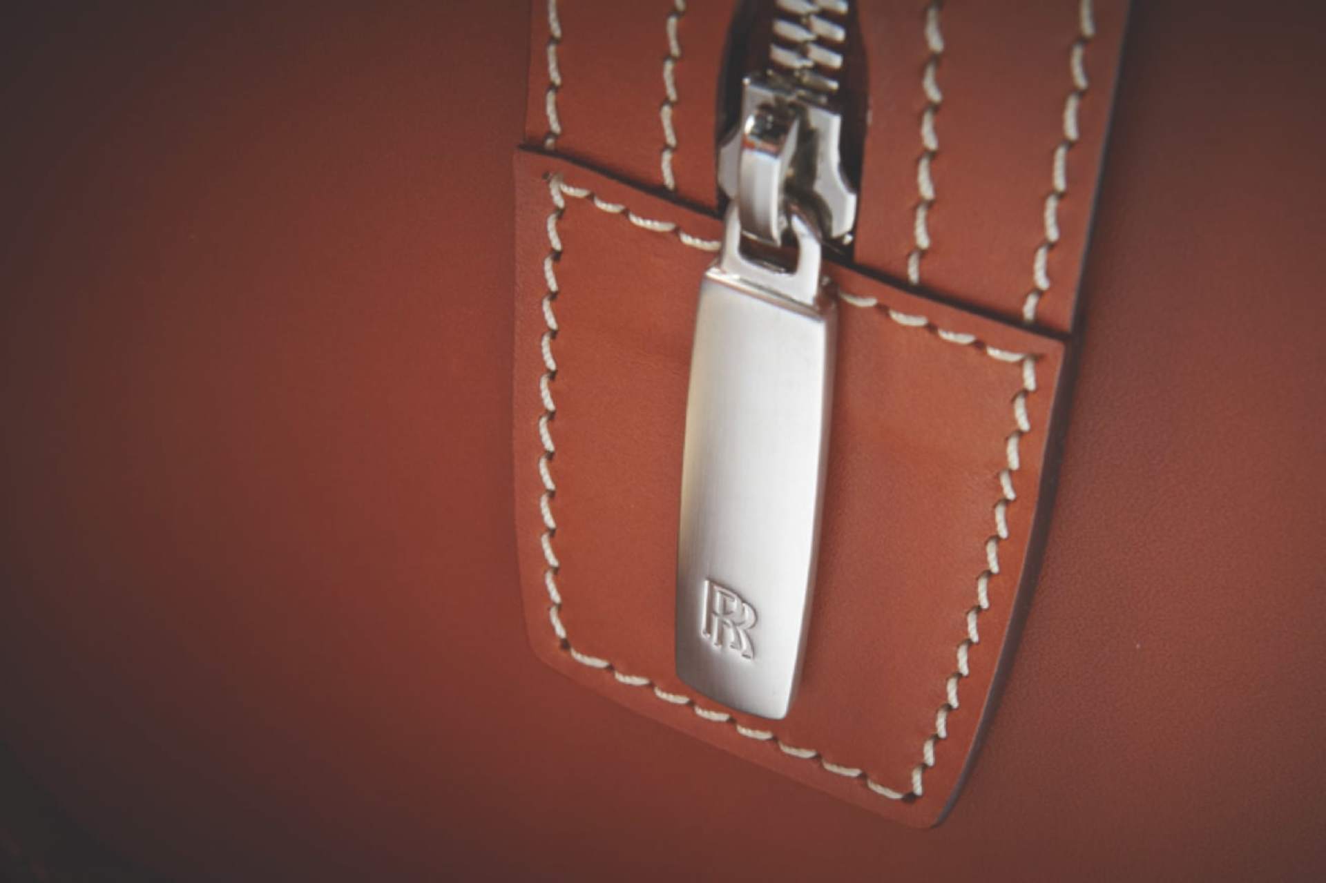 image of zip and stitch details on rolls-royce luggage