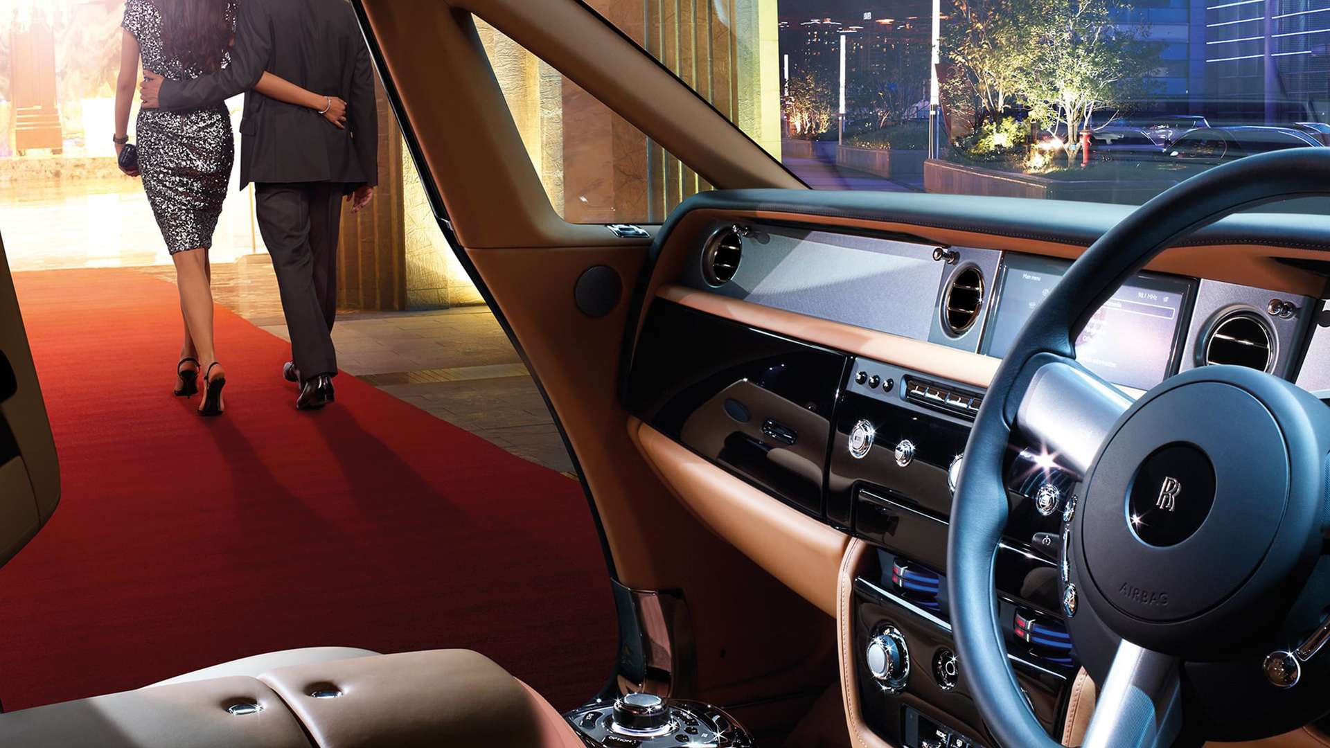 Interior dashboard of a Rolls-Royce Motor Car with the door open.