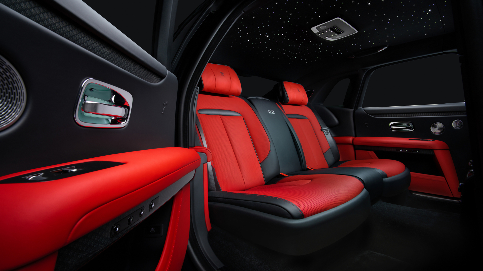 Red interior of black badge ghost displaying two passenger seats