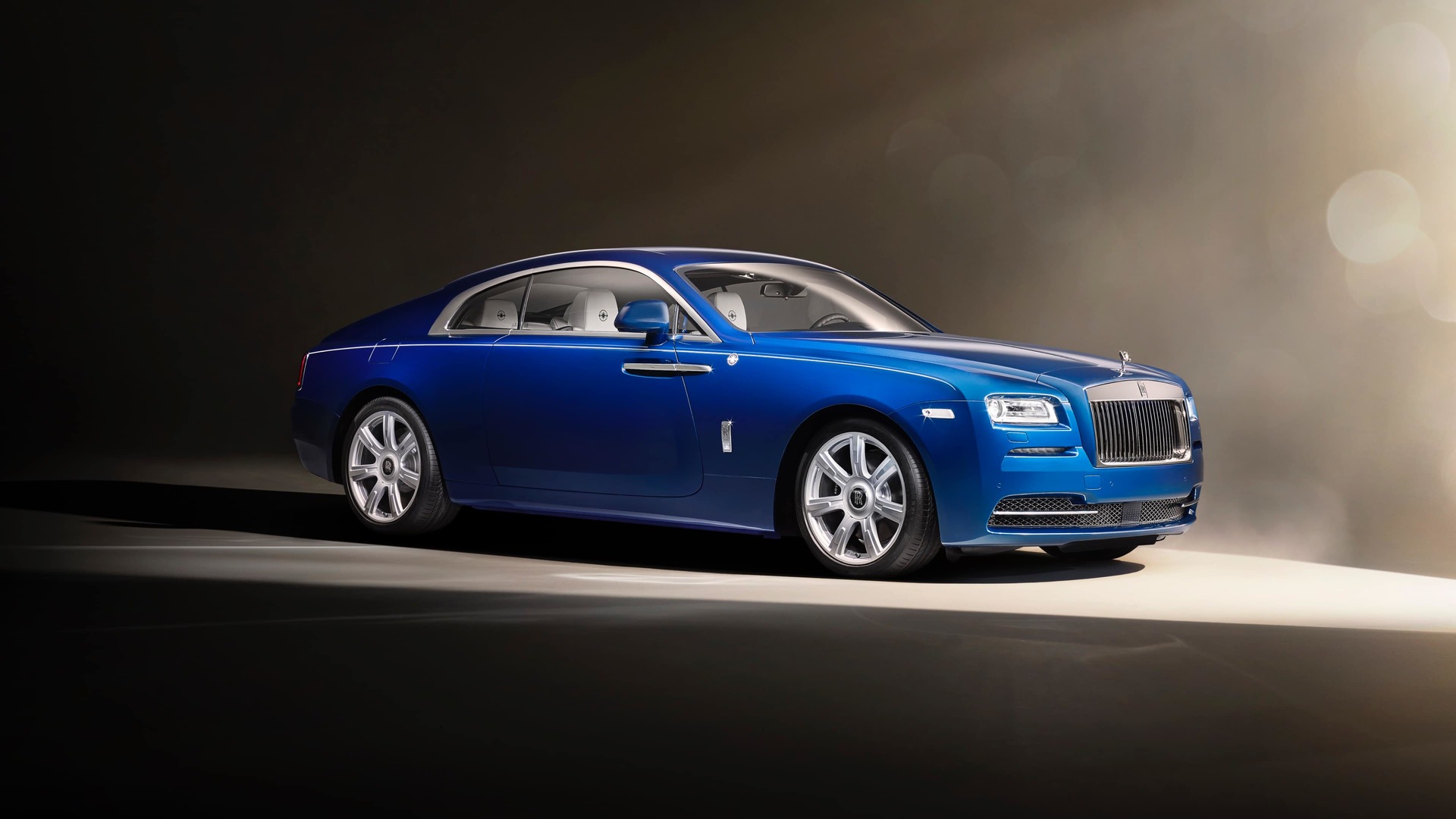 A blue Rolls-Royce Motor Cars Wraith with the silver finish wheel style 603