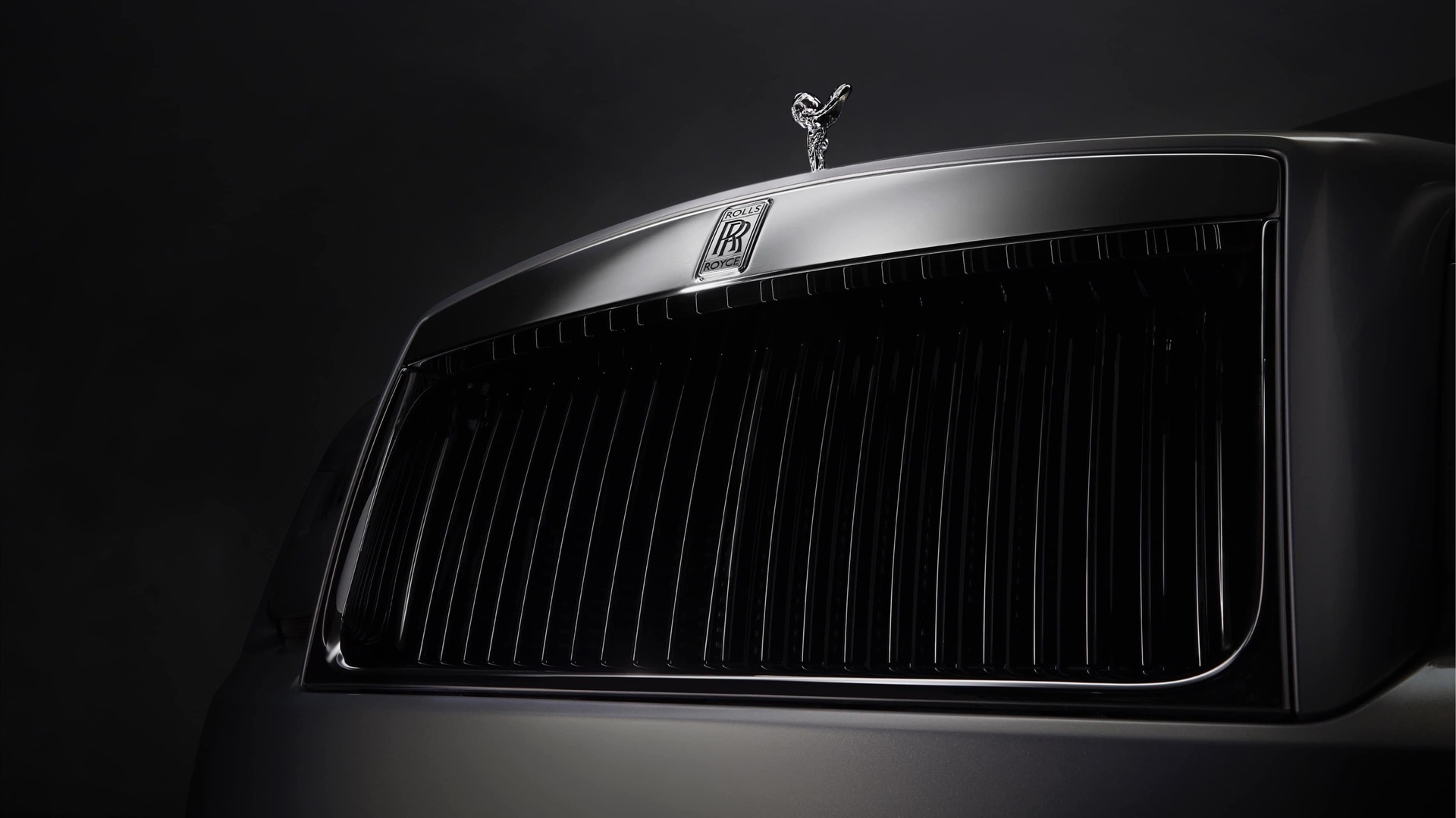 Front grille and Spirit of Ecstasy of Rolls-Royce motor car with Black Exterior detailing for a dark and modern feel