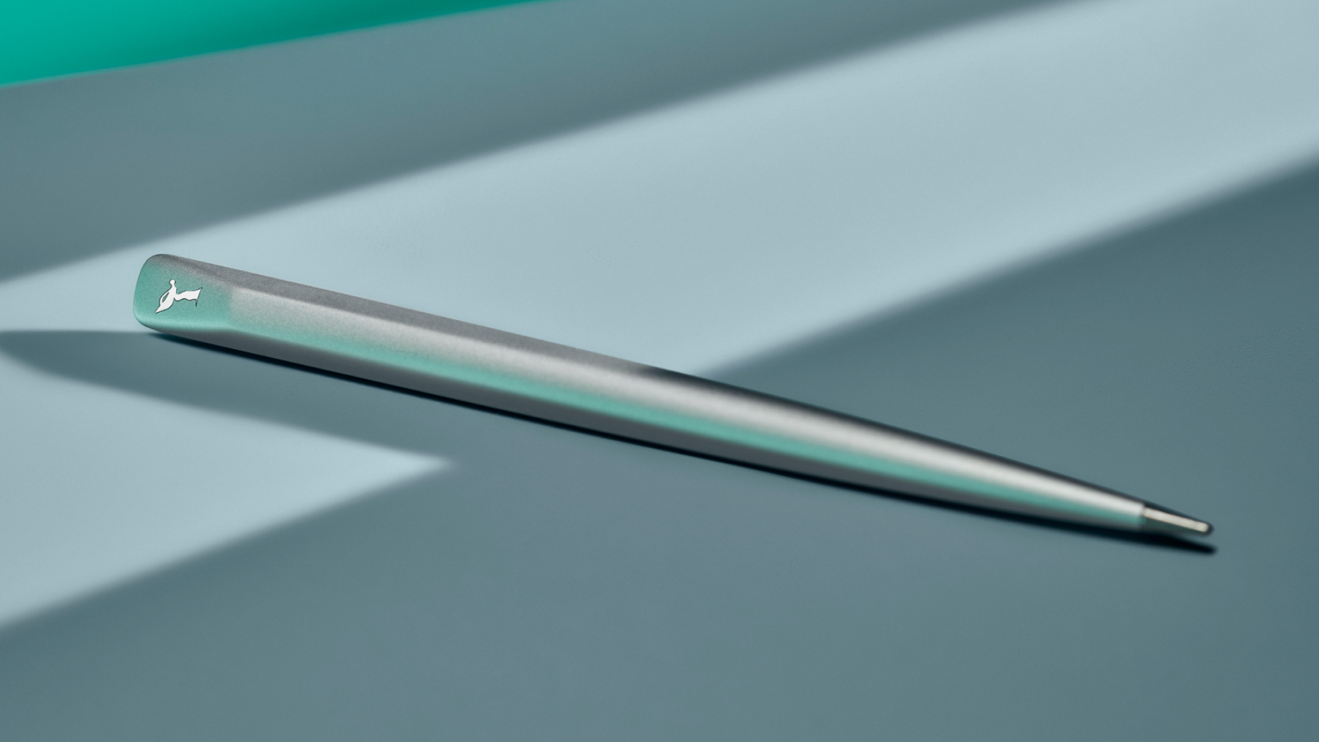 Close up view of the Rolls-Royce Infinity Stylus in silver finish with special focus on the subtle Spirit of Ecstacy detailing