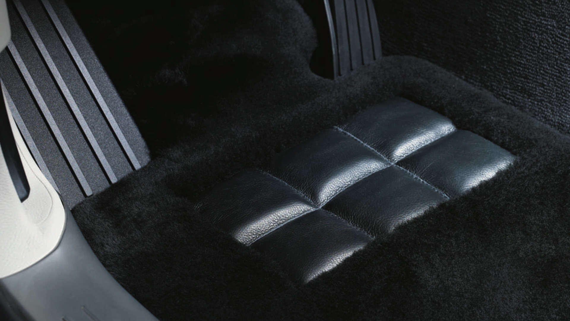 Tailor-made Rolls-Royce lambswool floor mat in black by driver's pedals