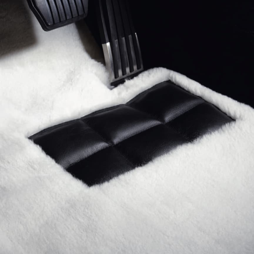 Tailor-made Rolls-Royce lambswool floor mat in white by driver's pedals