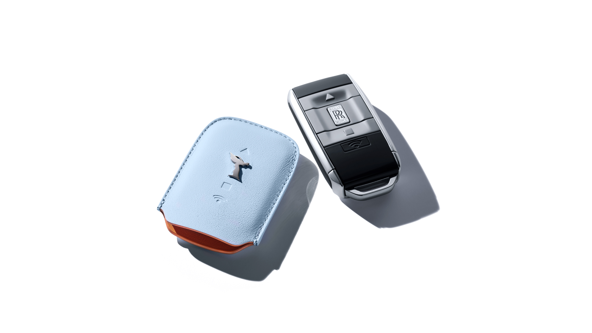 Rolls-Royce motor car key next to its key wrapper in Charles Blue and Mandarin
