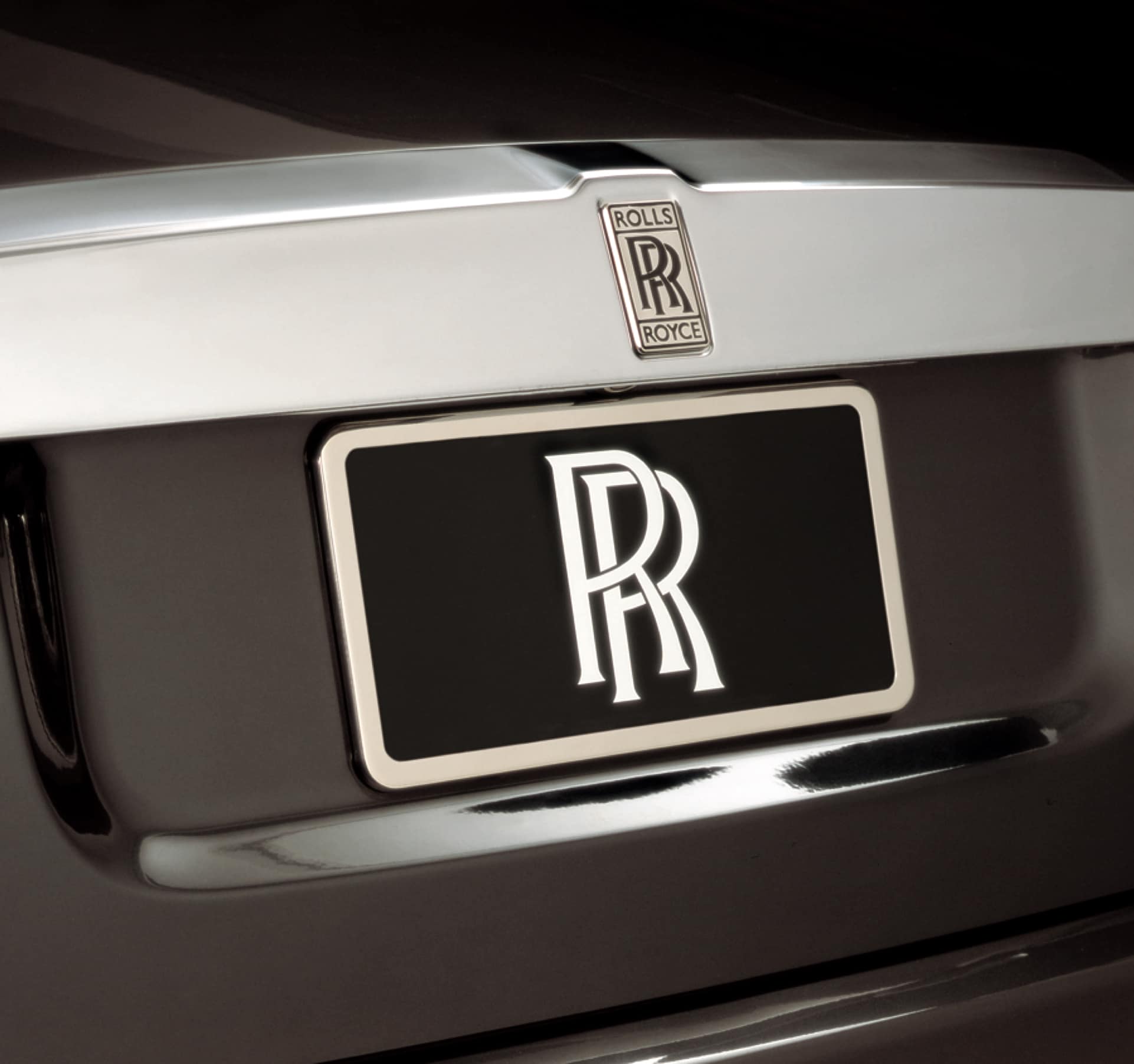 Rolls-Royce Motor Cars Accessory - Number plate surround, shows a Rolls-Royce motor car number plate with a silver coloured surround