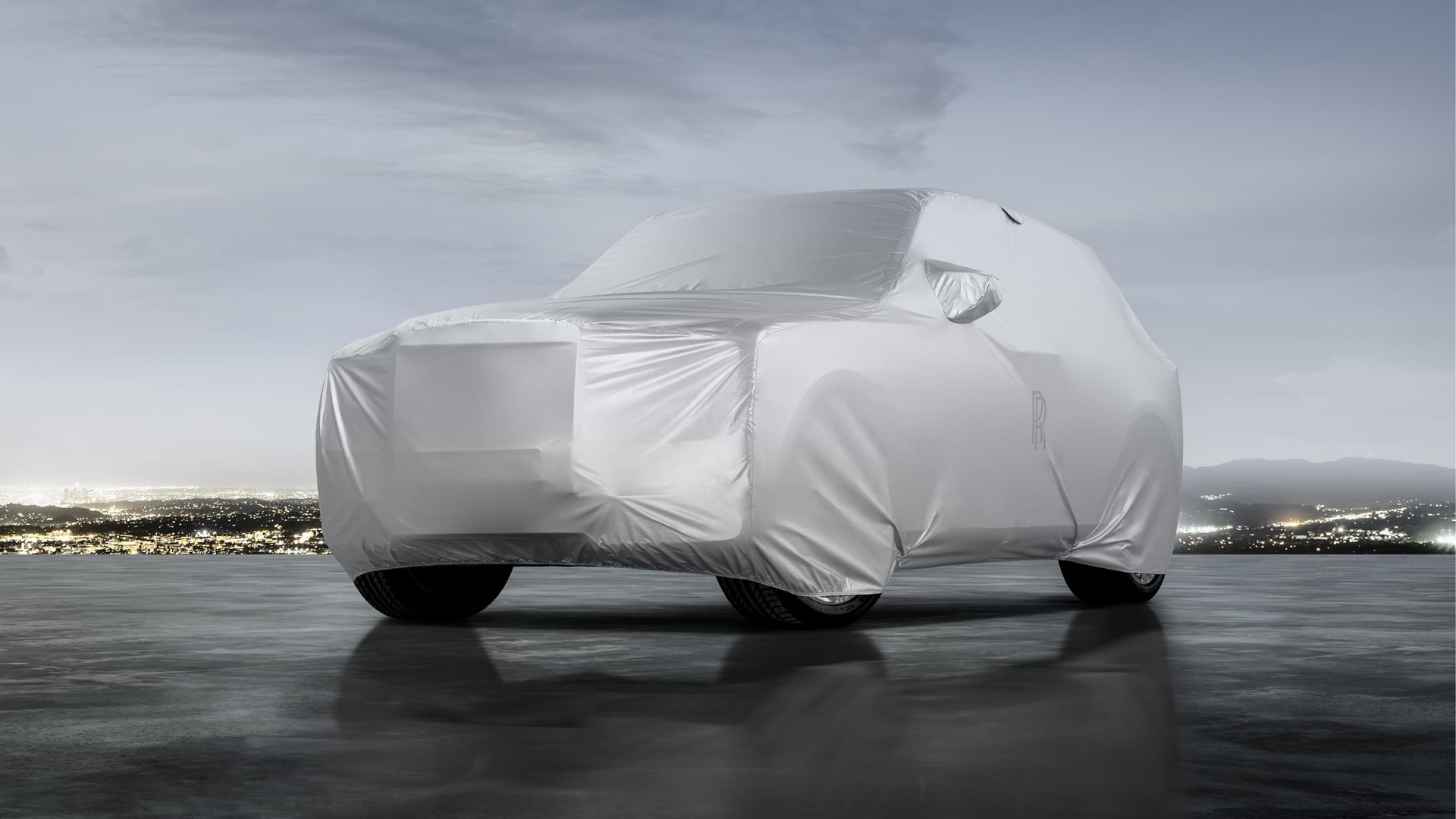 Rolls-Royce outdoor car cover for the Cullinan moto car detailed with subtle signature monogram