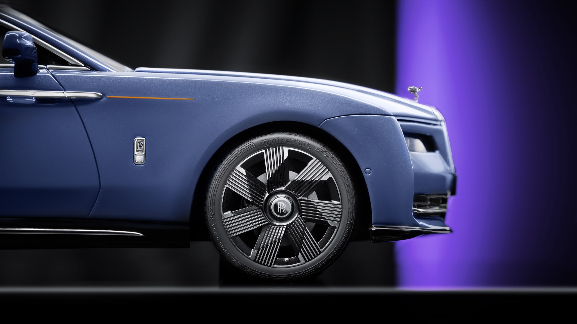 Detailed view of the Rolls-Royce Spectre replica model in blue.