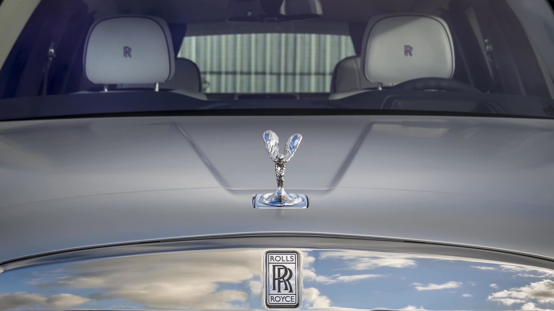 Bonnet detail with Spirit of Ecstasy and Badge of Honour on Rolls-Royce motor car with the Silver Satin Kit