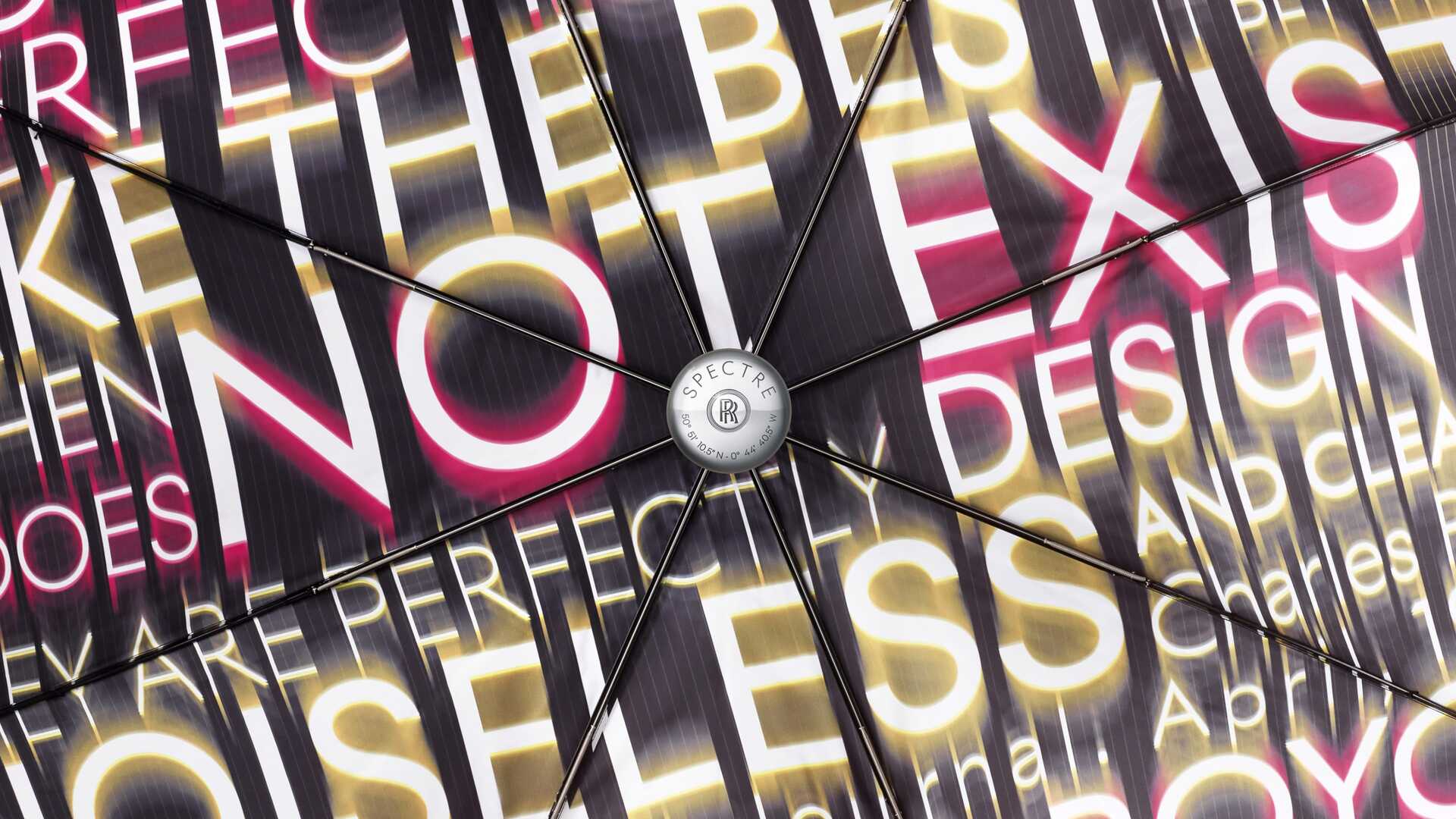 Detailed view of the inside of the Rolls-Royce umbrella with the striking Spectre prophecy and a commemorative etching on the handle