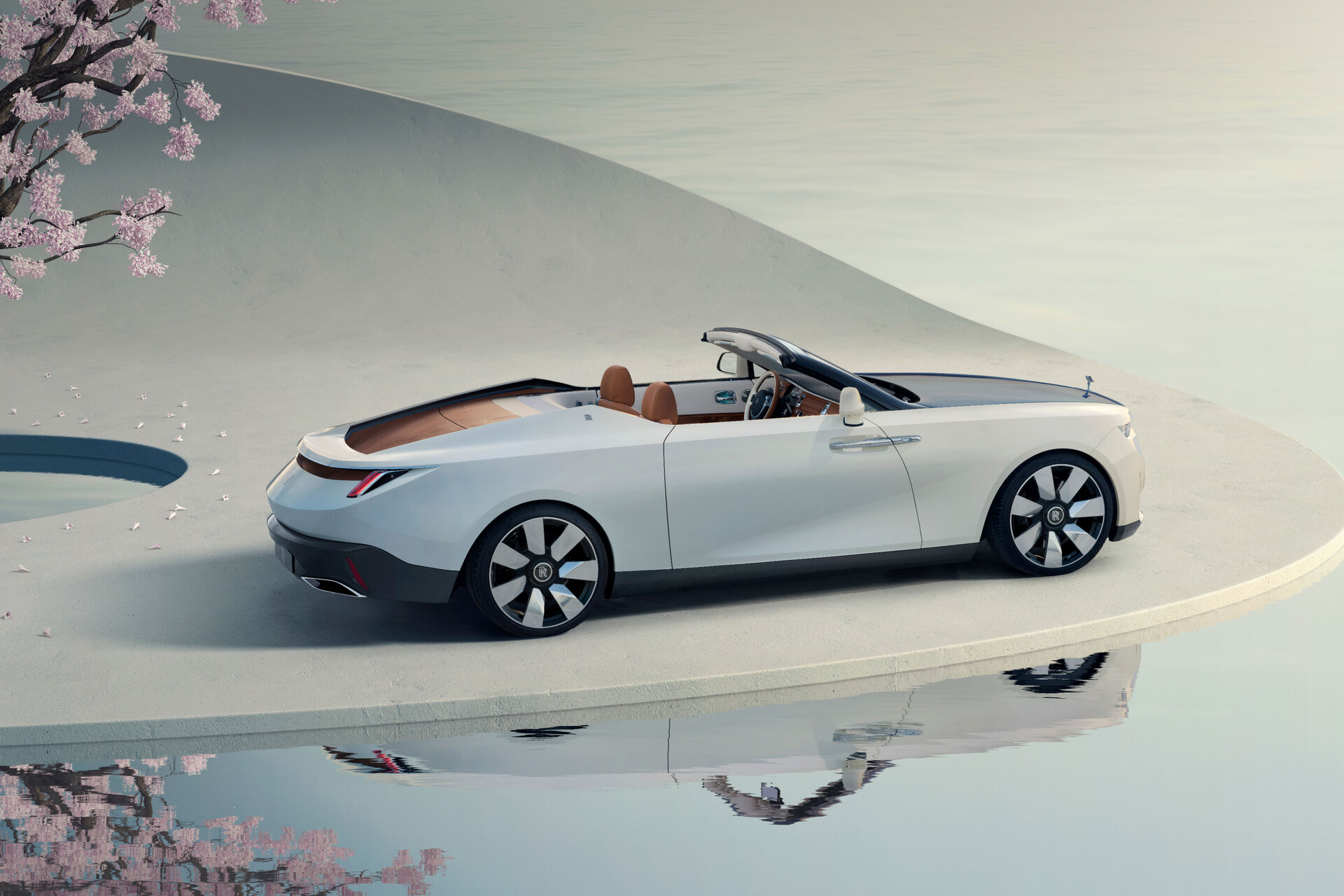 Side profile of Arcadia Droptail on a concrete platform with it's reflection appearing in the water