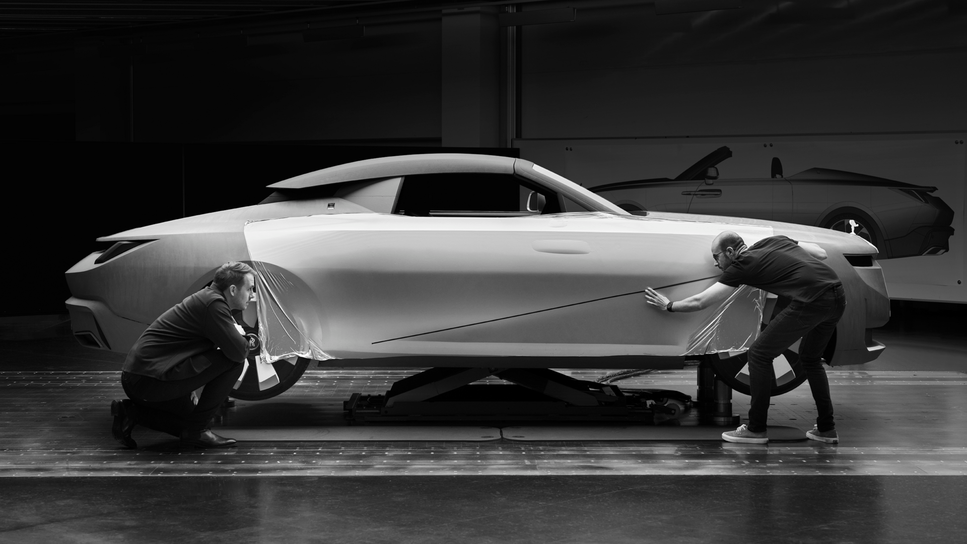 Two professional technicians taking care of every small detail of the Rolls-Royce Couchbuild