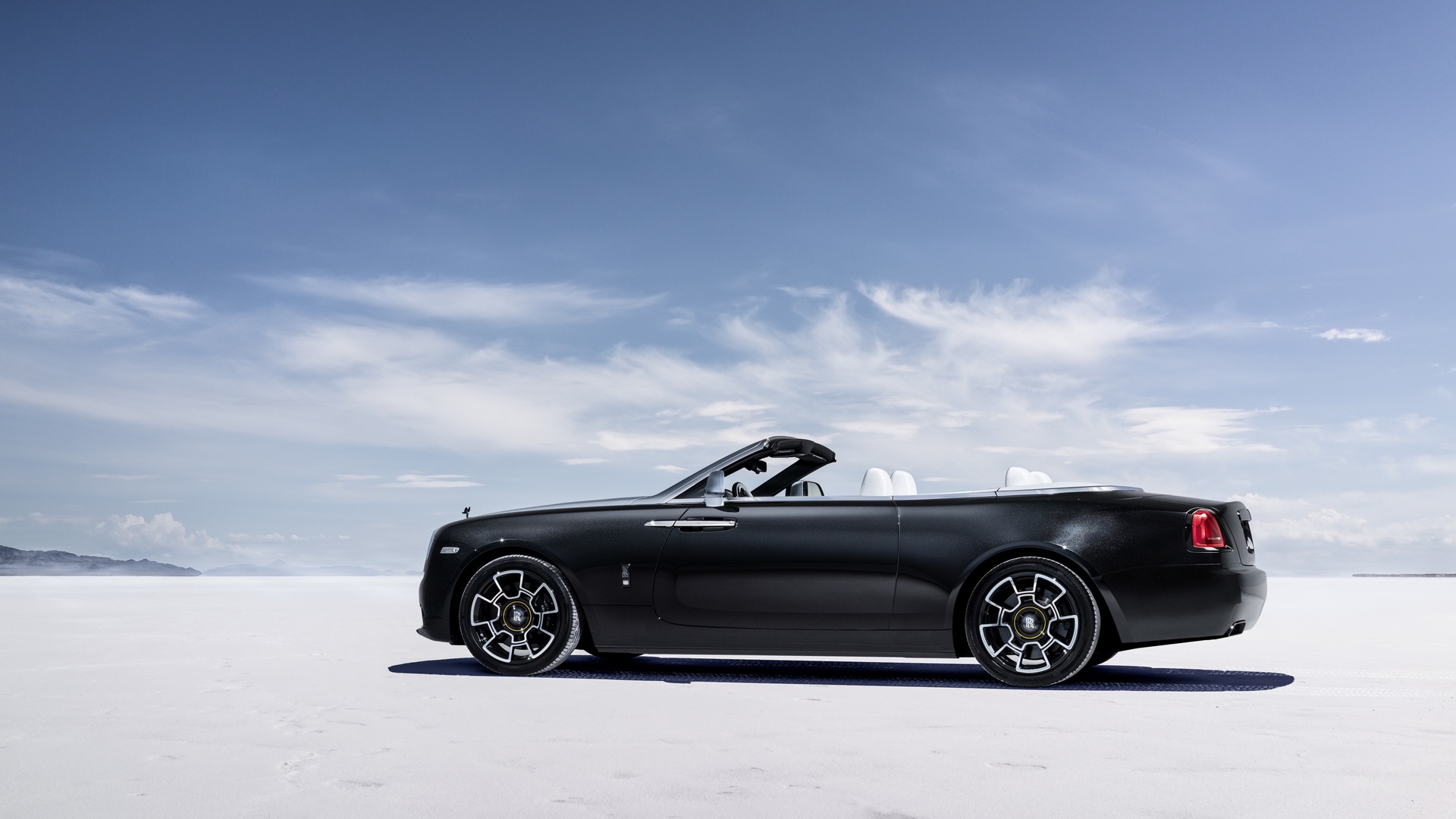 Front side profile of the Dawn Landspeed with the roof open on the salt flats