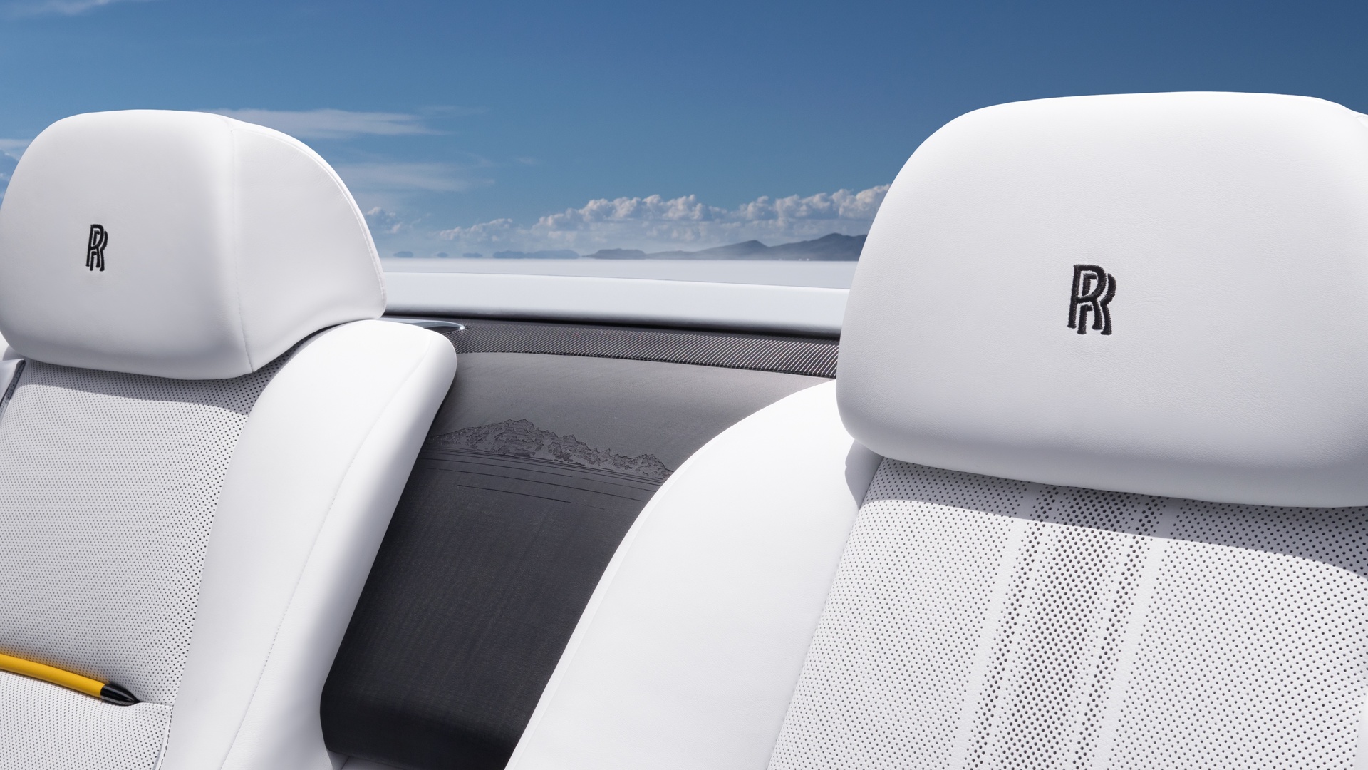 Interior of the Dawn rear seats showing the track guide and waterfall engraving features