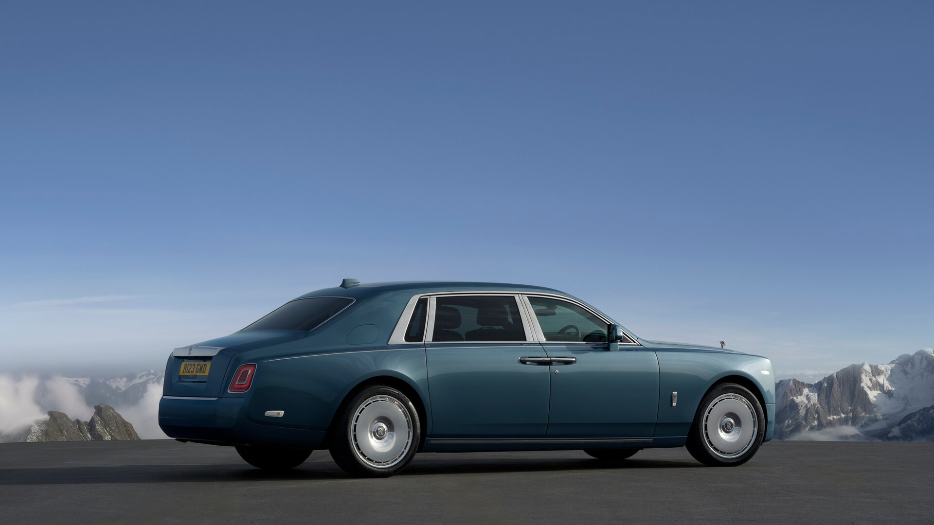 Side profile of a blue Phantom Extended with mountains in the background