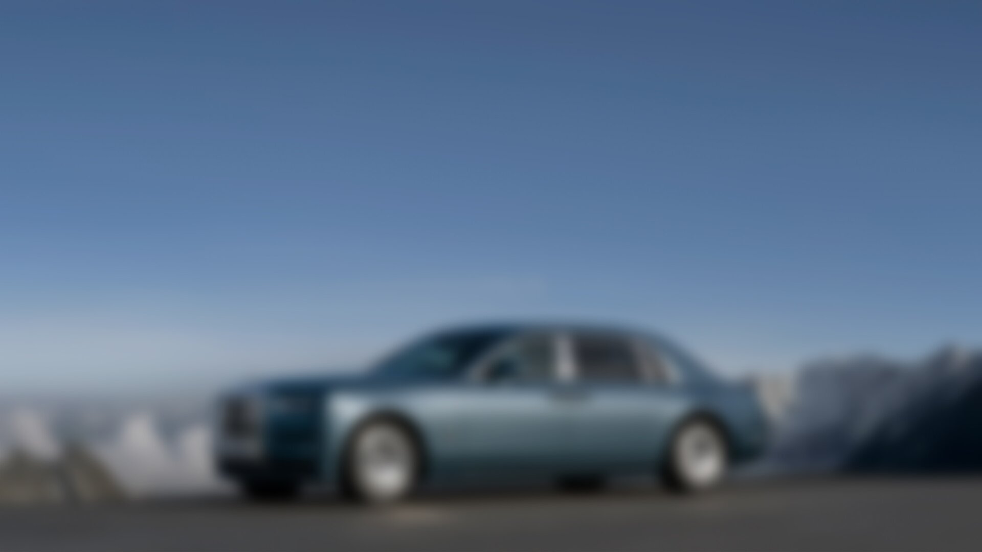 Front 3/4 of blue Phantom Extended on with a vast mountain-scape in the background.