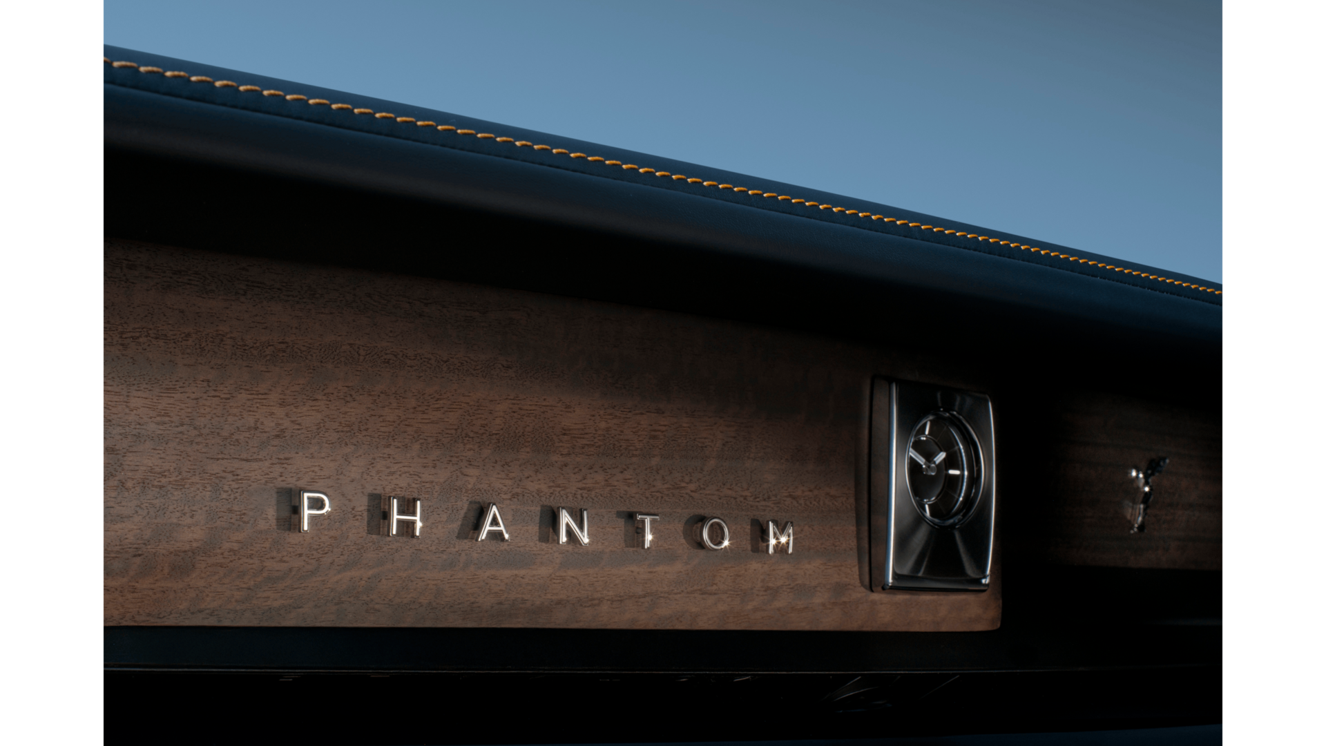 Interior image of the Phantom with "Phantom" positioned against a wood fascia