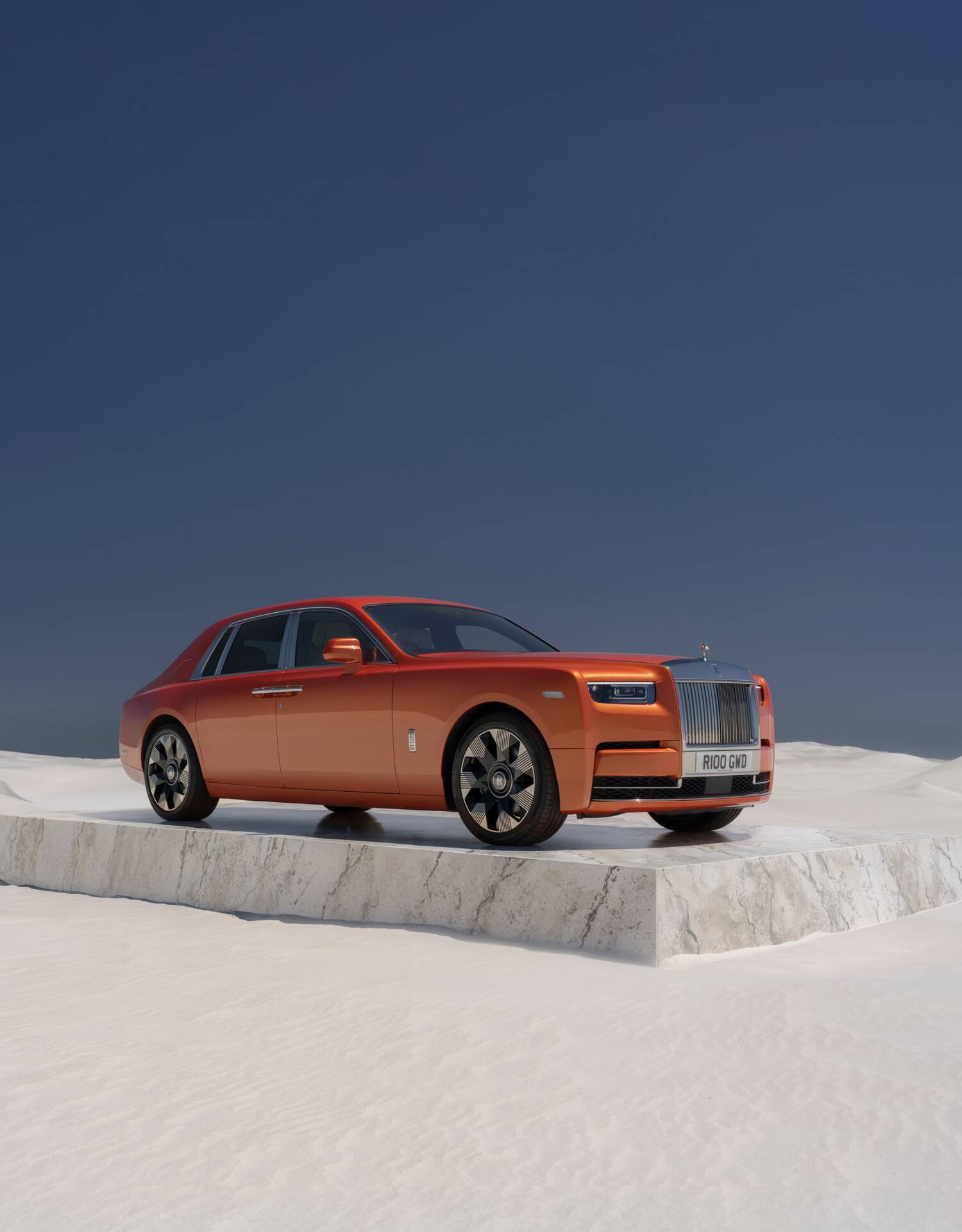 Front 3/4 of an Orange Phantom on a slab of marble in the middle of the desert