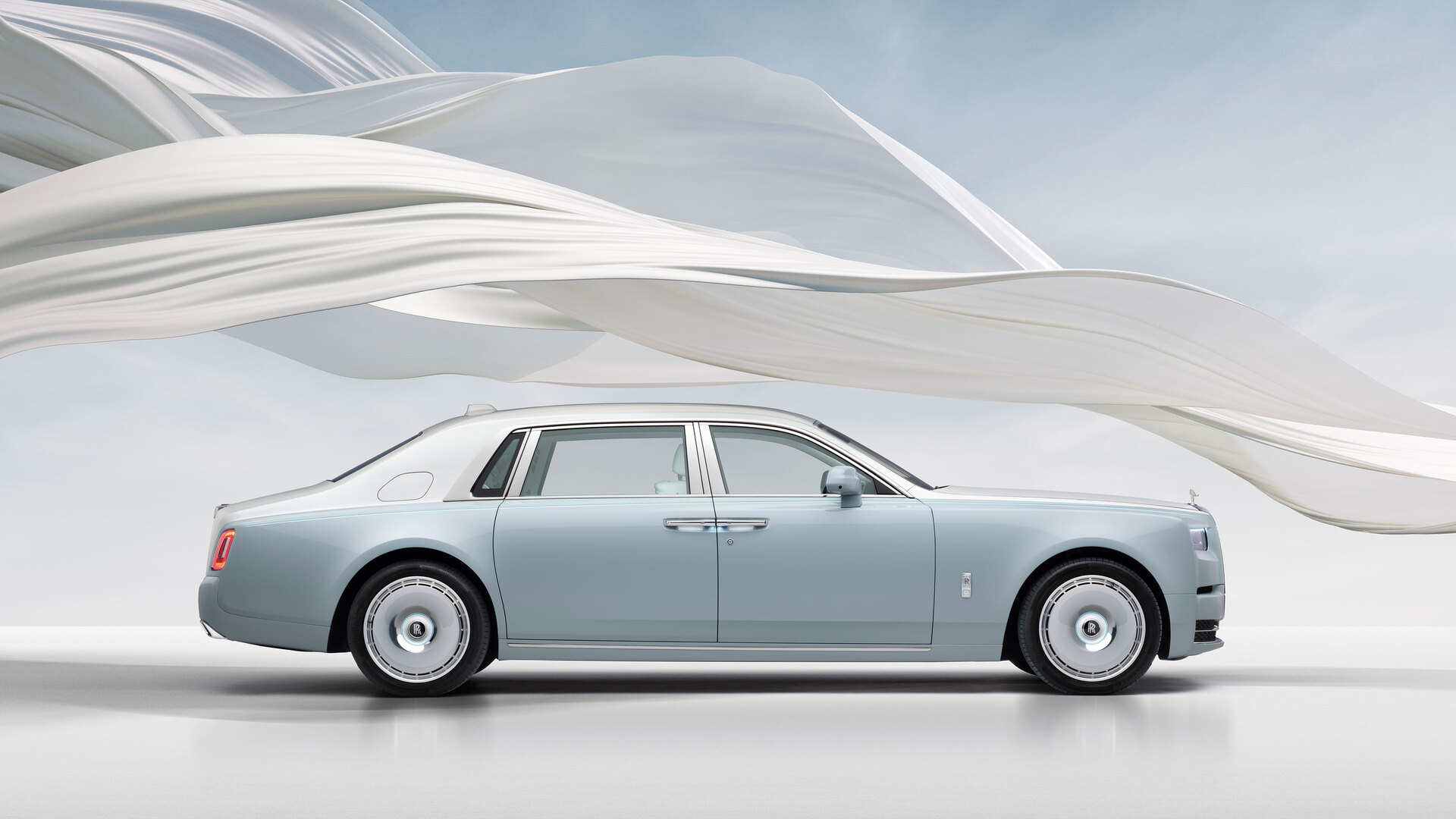 Phantom Scintilla full car image with the white ribbon circling it with the blue sky in the background.