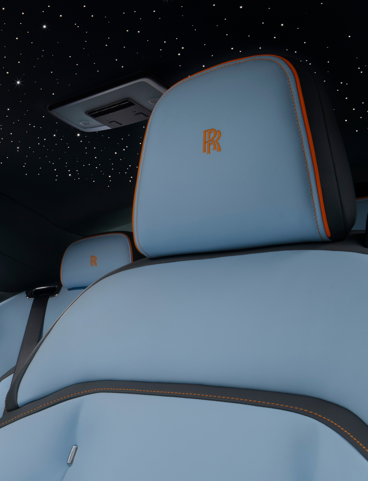 Close up shot of inside of the Spectre. Showcasing the stars in the roof, and a blue and orange seat.