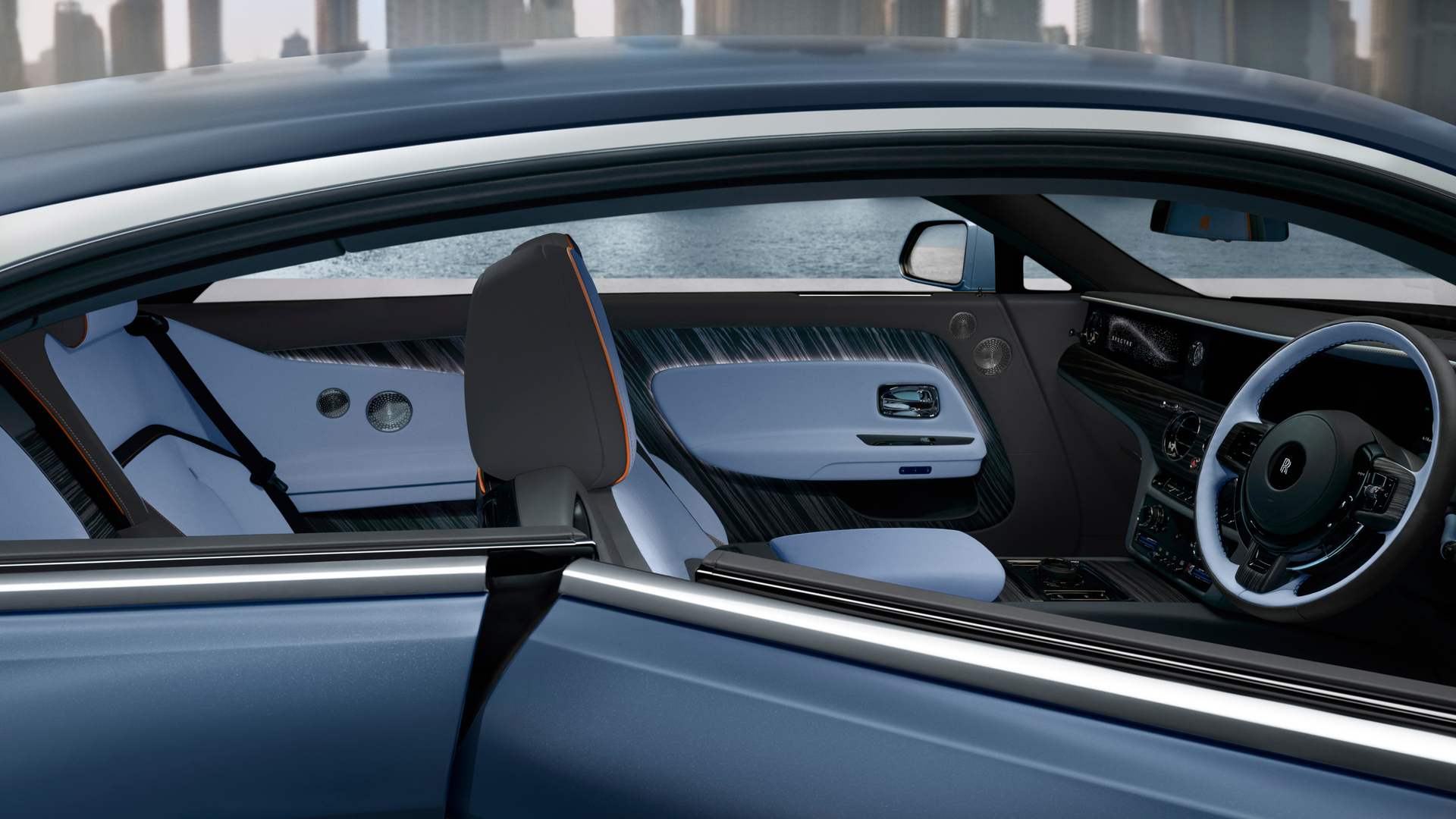 Close-up of the Rolls-Royce Spectre with the door open featuring the inside of the car