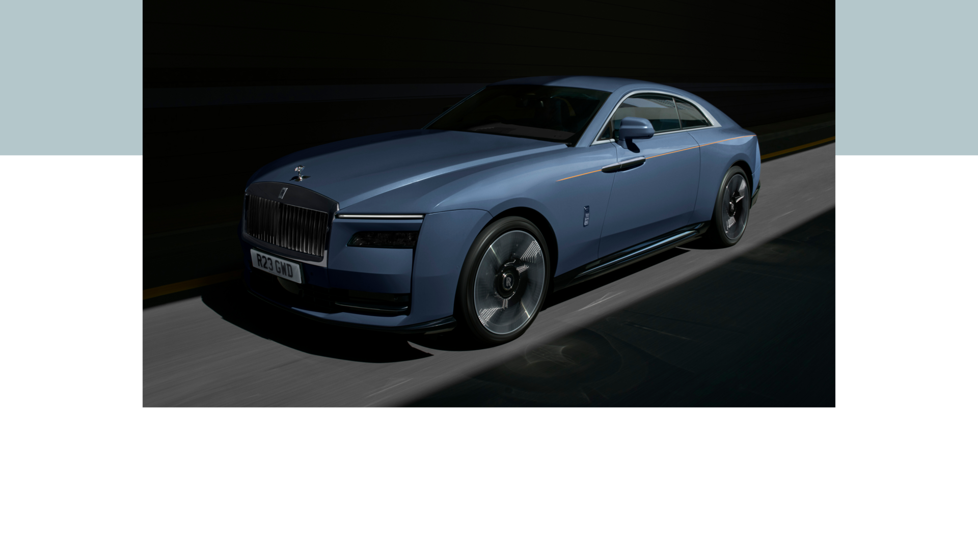 Front of the Rolls-Royce Spectre car driving at night