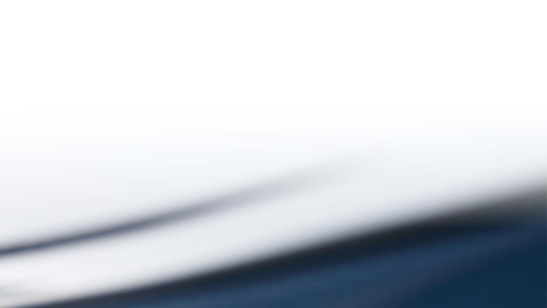 White background with blue waves coming across the backdrop.