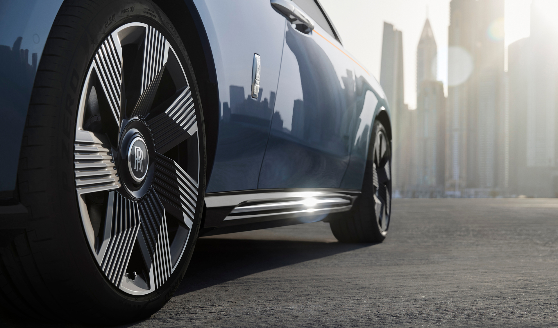 Shot of the side of the Spectre showing the rims glistening from the sunshine.