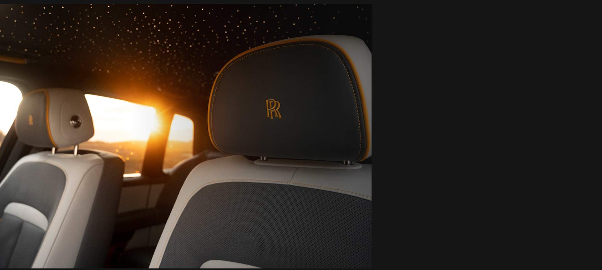 Interior details showing bespoke headrest and starlight headliner in the bespoke Rolls-Royce Black Badge Cullinan Capella motor car