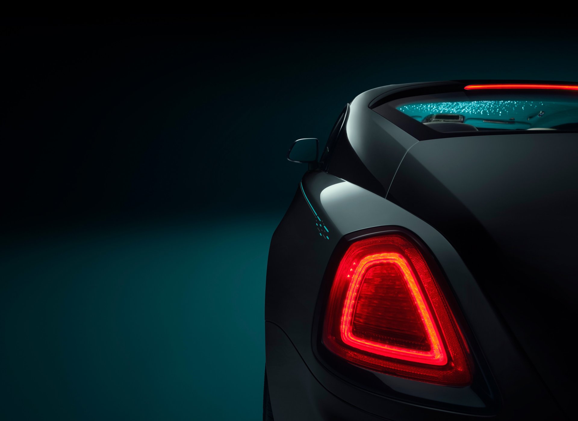 Exterior view of illuminated rear light of bespoke Rolls-Royce Wraith Kryptos motor car