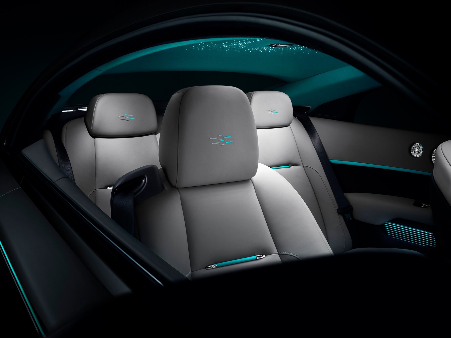 Bespoke interior showcasing headrest detailing and starlight headliner in Rolls-Royce Wraith Kryptos motor car