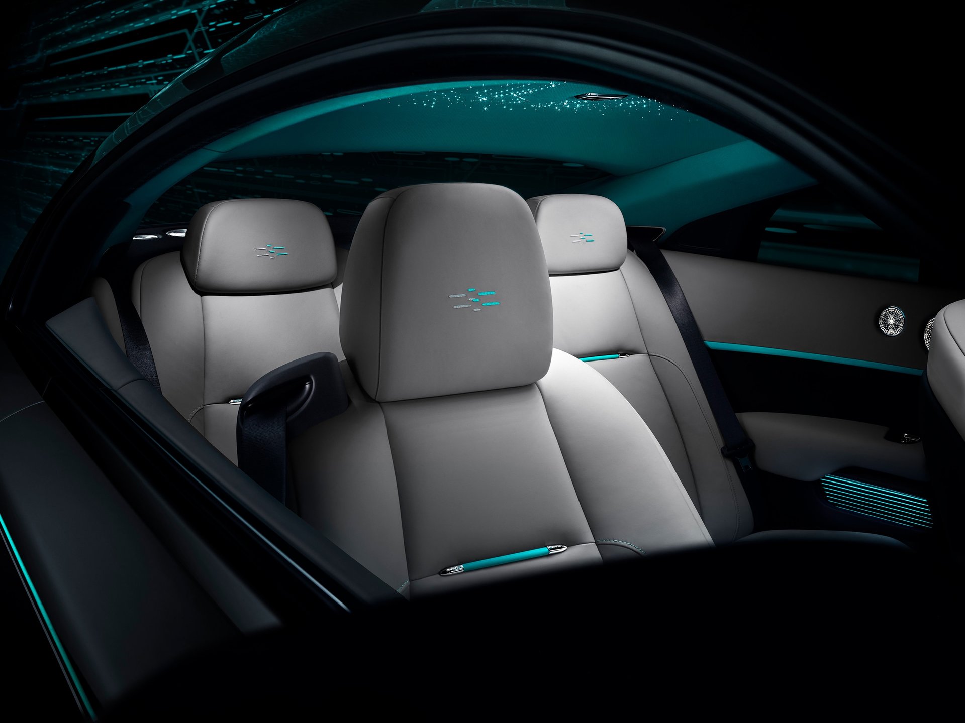 Bespoke interior showcasing headrest detailing and starlight headliner in Rolls-Royce Wraith Kryptos motor car