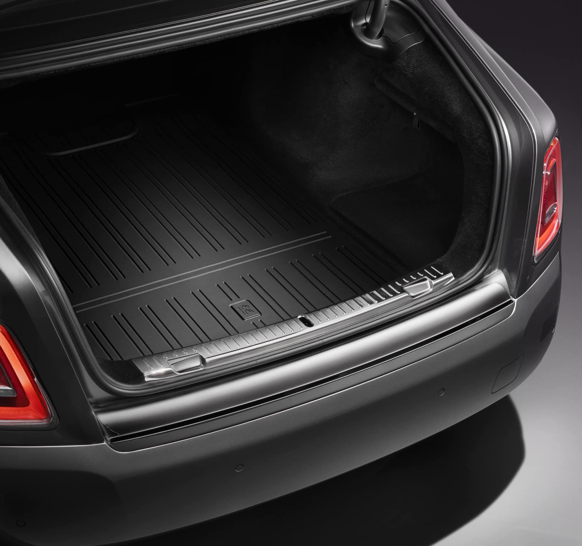 Luggage compartment of Rolls-Royce motor car with durable, rubberised, non-slip mat