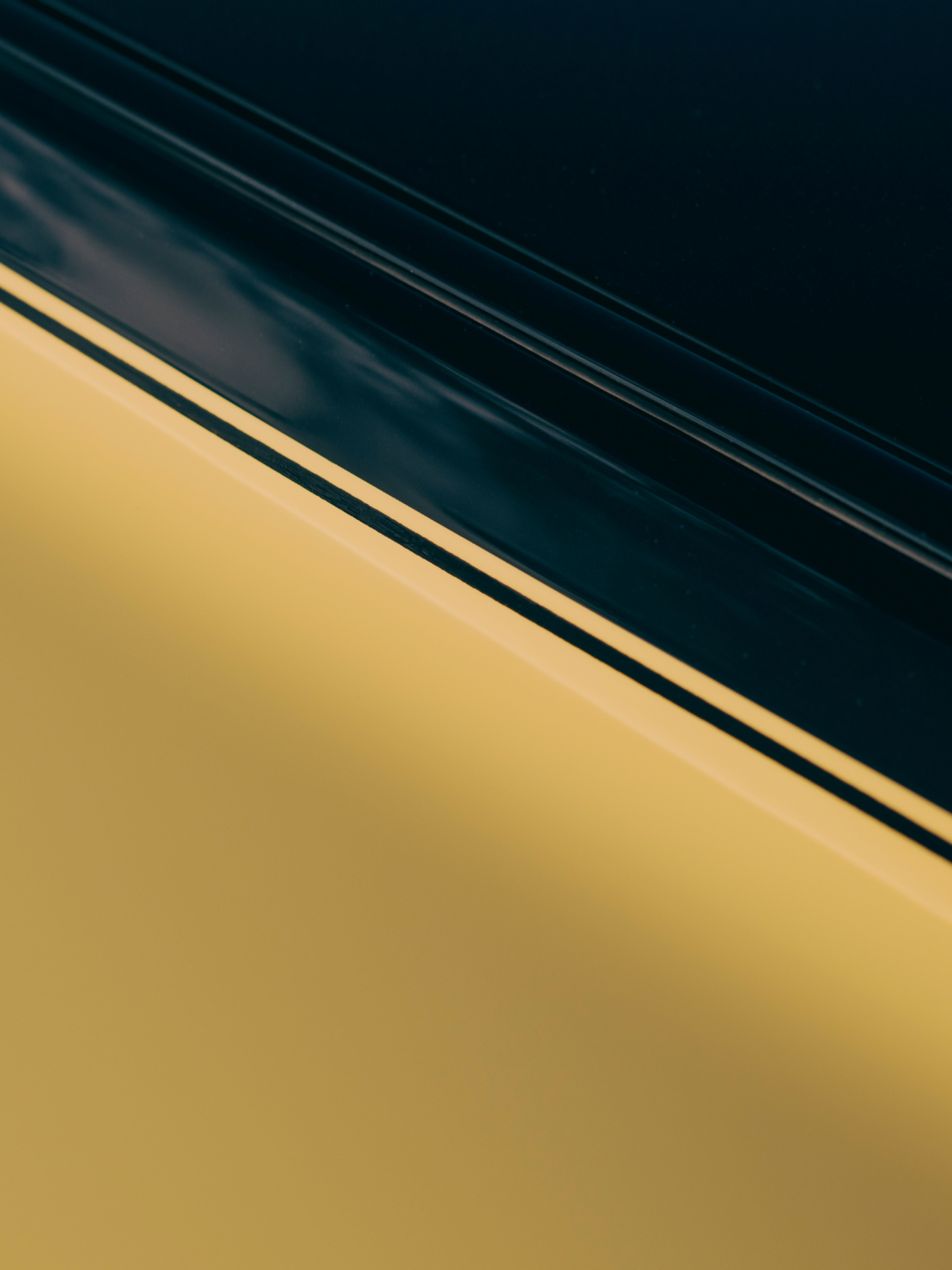 Close up of the side of the car, two toned black and gold Phantom Goldfinger.